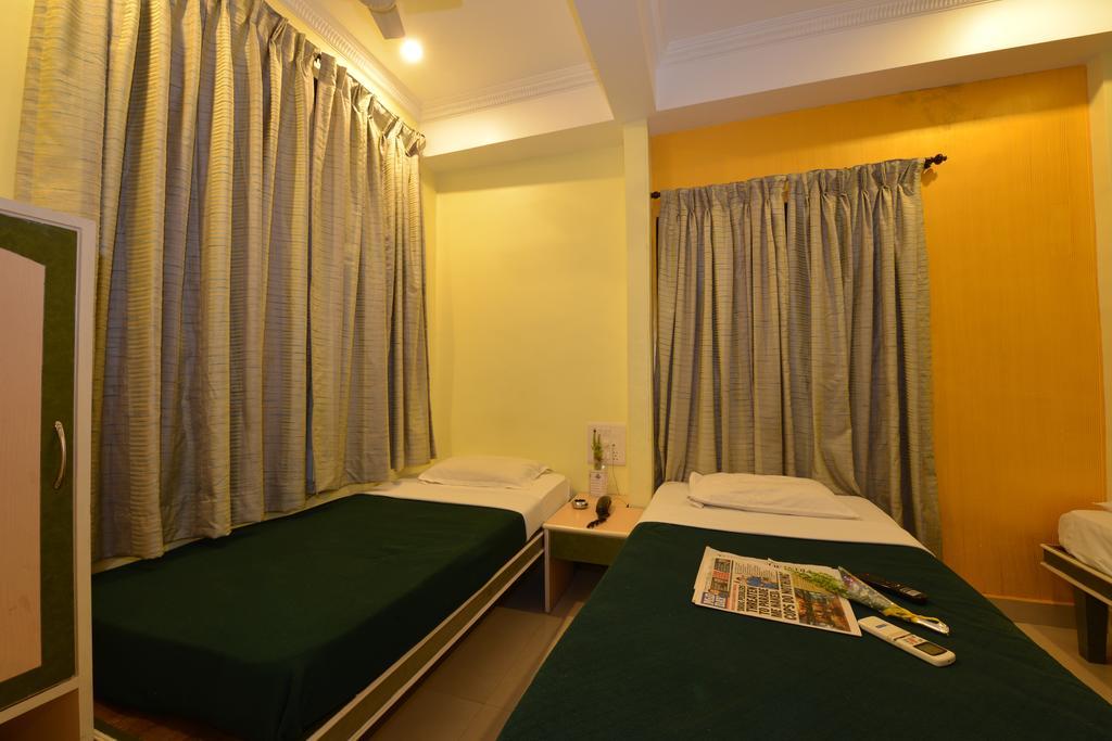 Hotel City Palace Bombaim Quarto foto
